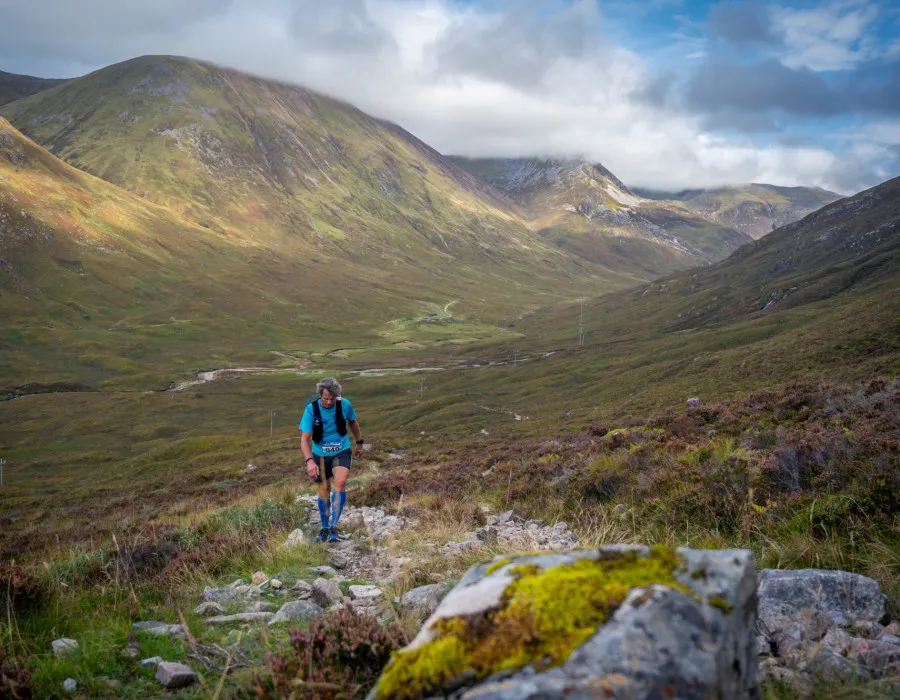 Man walking up mountain