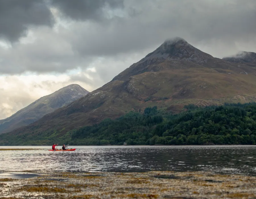 Participants kayaking across water